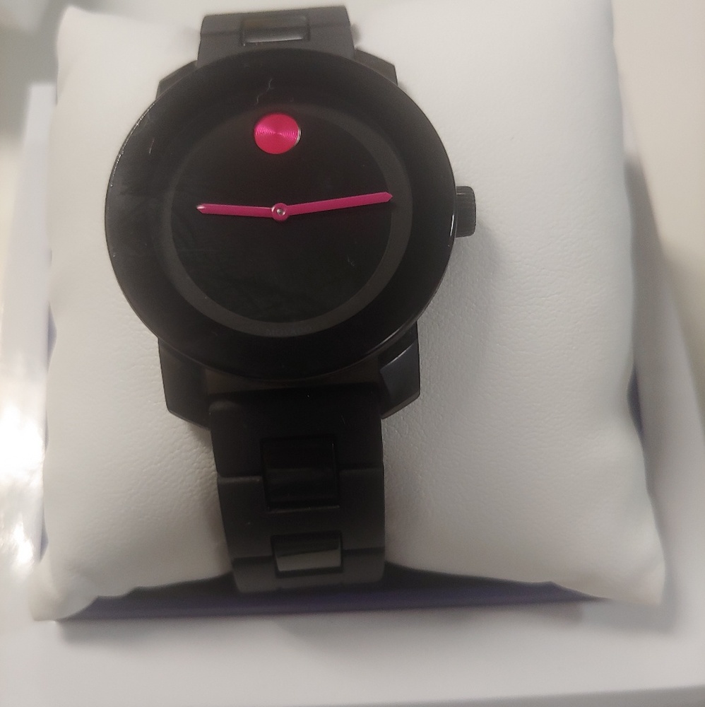 Movado woman watch.. Black with pink dial